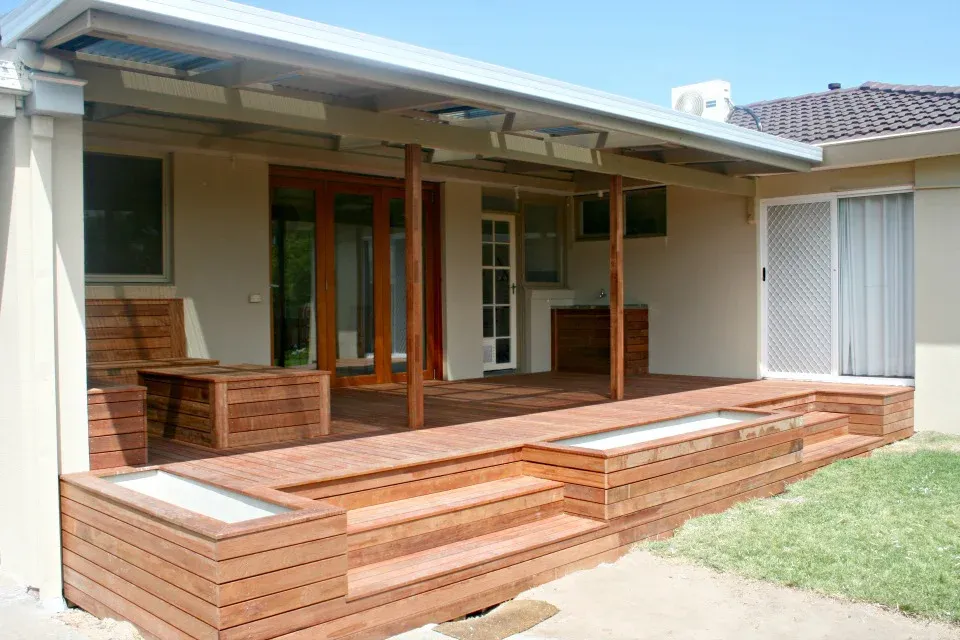 Merbau deck with built-in planter boxes and steps